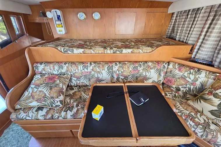 Slide: The Image of 1993 McKinna 48 Pilothouse interior with floral upholstery and wooden accents. - 40