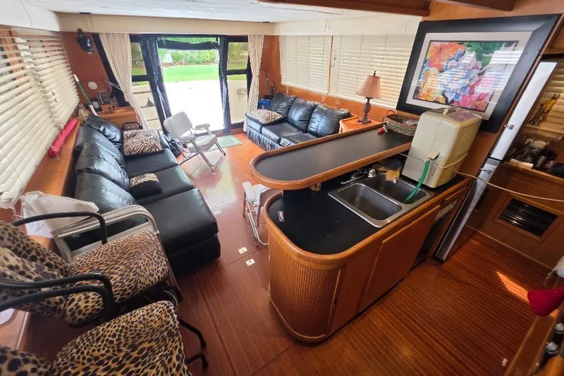 Slide: The Image of Luxurious interior of a 1993 McKinna 48 Pilothouse yacht with modern furnishings. - 20