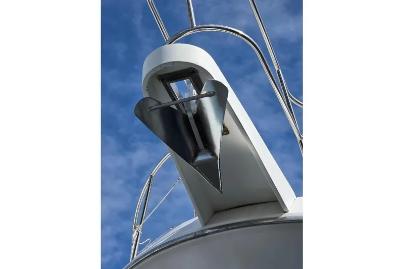 Slide: The Image of Anchor of 1993 McKinna 48 Pilothouse against blue sky background. - 104