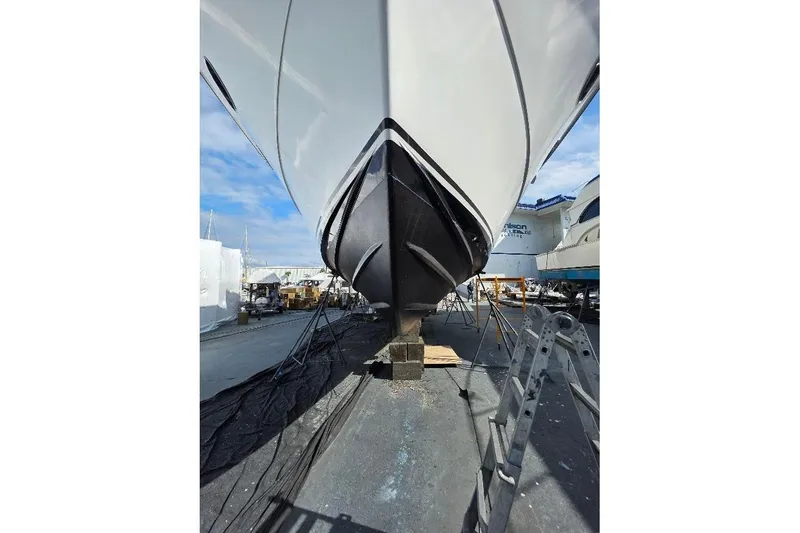 Slide: The Image of 1993 McKinna 48 Pilothouse yacht on dry dock, viewed from the bow. - 101