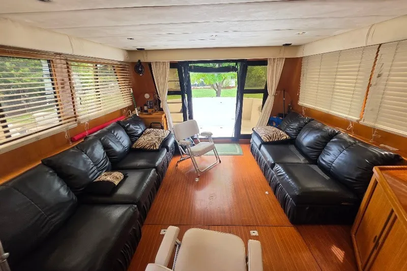 Slide: The Image of Luxurious interior of 1993 McKinna 48 Pilothouse with leather seating and wood flooring. - 21