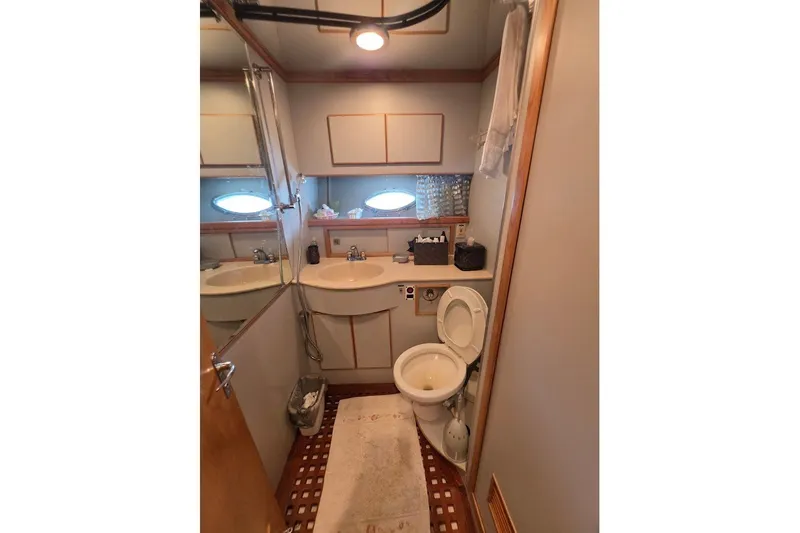 Slide: The Image of Bathroom interior of 1993 McKinna 48 Pilothouse yacht with sink and toilet. - 140