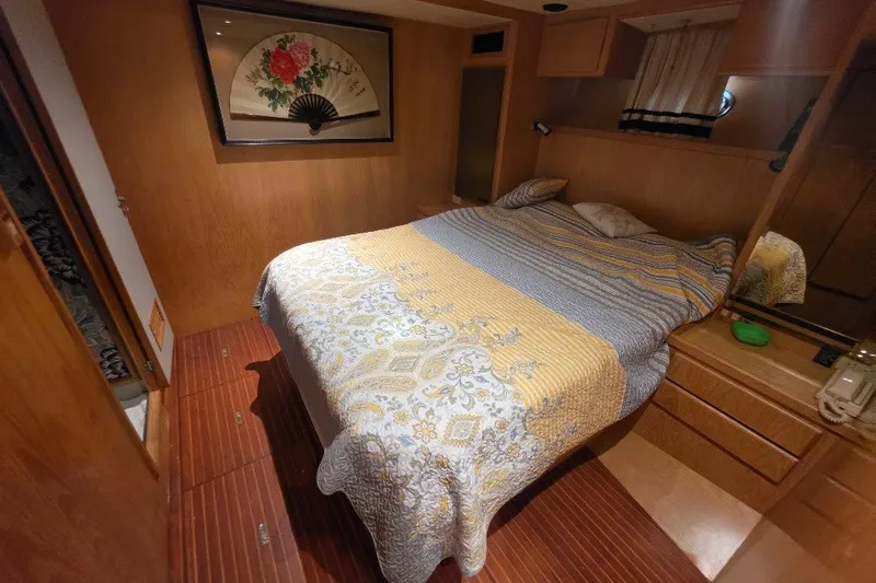 Slide: The Image of Cozy bedroom in 1993 McKinna 48 Pilothouse yacht with decorative fan art. - 58