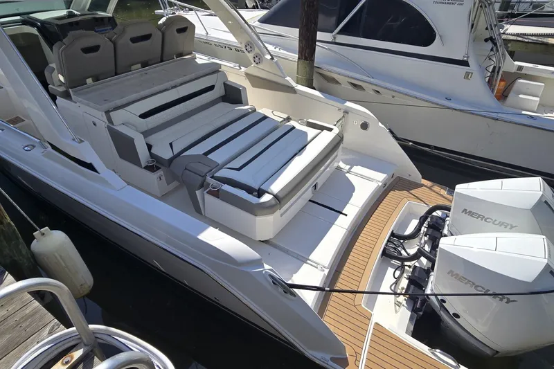 Slide: The Image of 2022 Tiara Yachts 34 LS with Mercury engines, featuring luxurious seating and sleek design. - 10