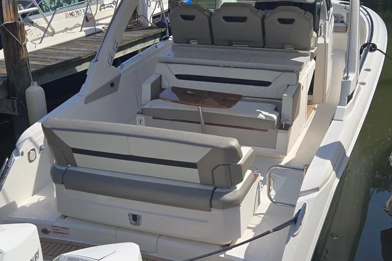 Slide: The Image of 2022 Tiara Yachts 34 LS luxury boat interior with seating and table. - 7