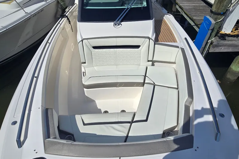 Slide: The Image of 2022 Tiara Yachts 34 LS boat with luxurious seating and sleek design. - 18