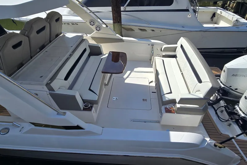 Slide: The Image of 2022 Tiara Yachts 34 LS interior with luxurious seating and modern design. - 9