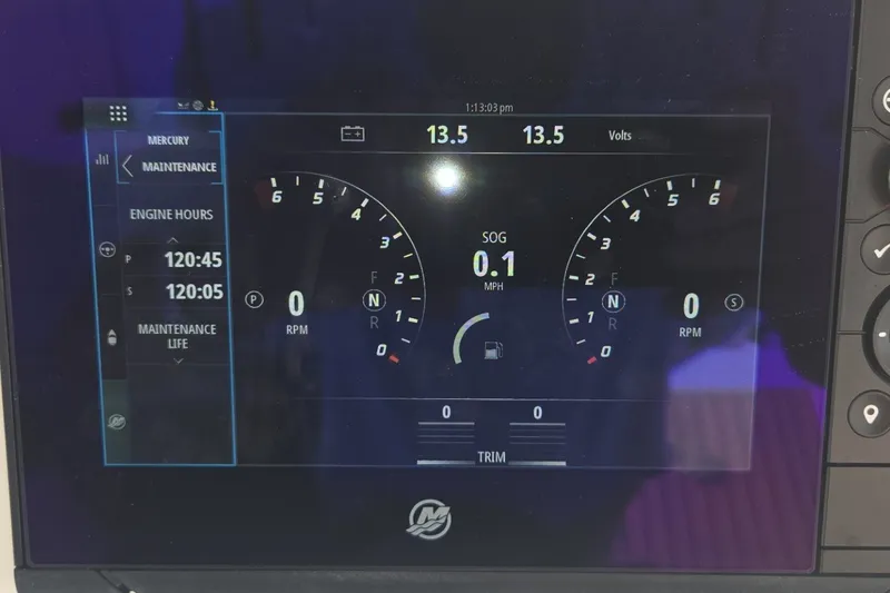 Slide: The Image of Dashboard display of a 2022 Tiara Yachts 34 LS, showing engine metrics and maintenance data. - 39