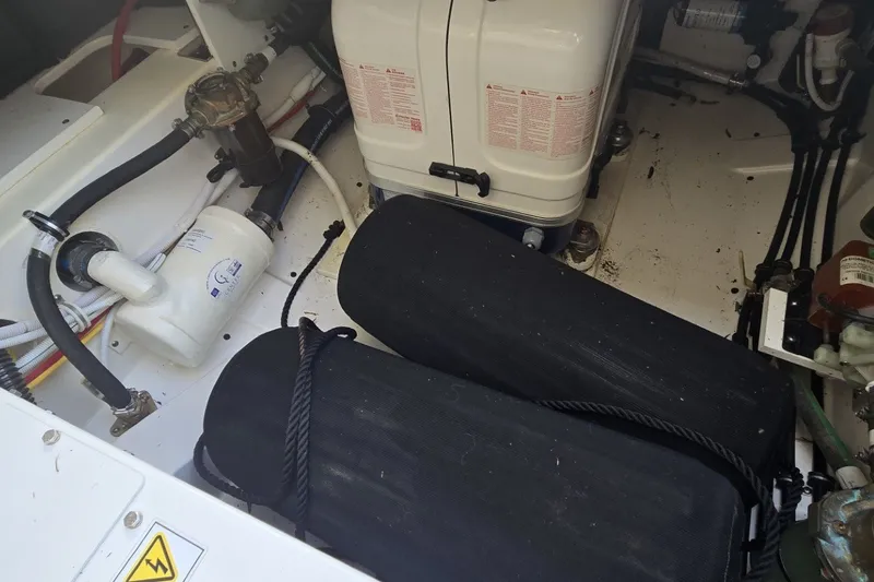 Slide: The Image of Engine compartment of 2022 Tiara Yachts 34 LS, showcasing mechanical components and wiring. - 29