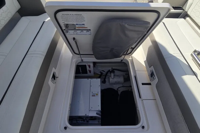 Slide: The Image of Open engine compartment of 2022 Tiara Yachts 34 LS, showcasing interior components. - 27