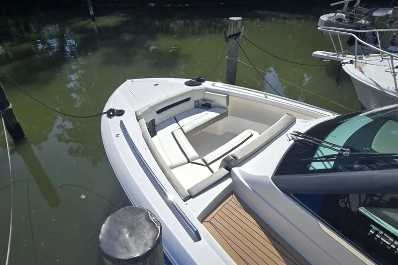 Slide: The Image of 2022 Tiara Yachts 34 LS boat with spacious seating, docked in calm waters. - 15