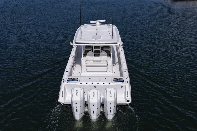Slide: The Image of 2026 Everglades 455 Center Console boat with triple 600 V12 engines on water. - 17