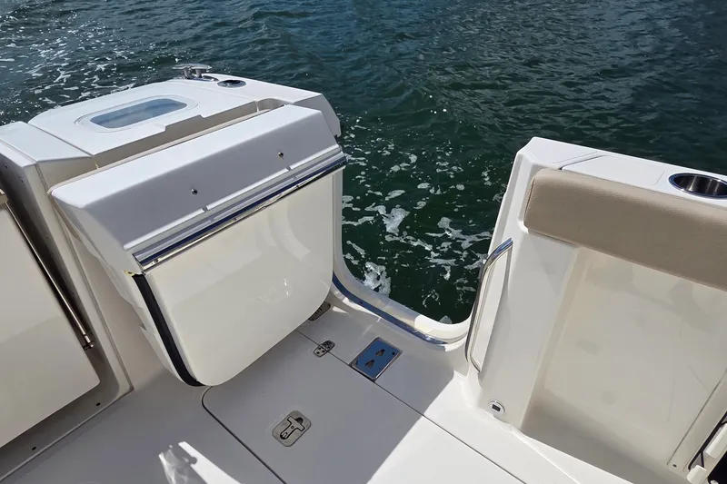Slide: The Image of 2019 Pursuit S 328 Sport boat deck with water view and seating area. - 29