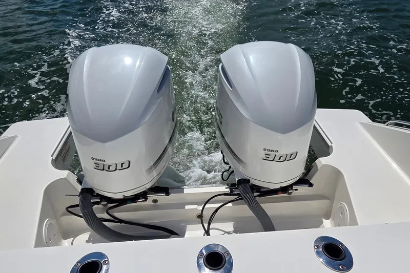 Slide: The Image of Twin Yamaha 300 engines on a 2019 Pursuit S 328 Sport boat in motion. - 27