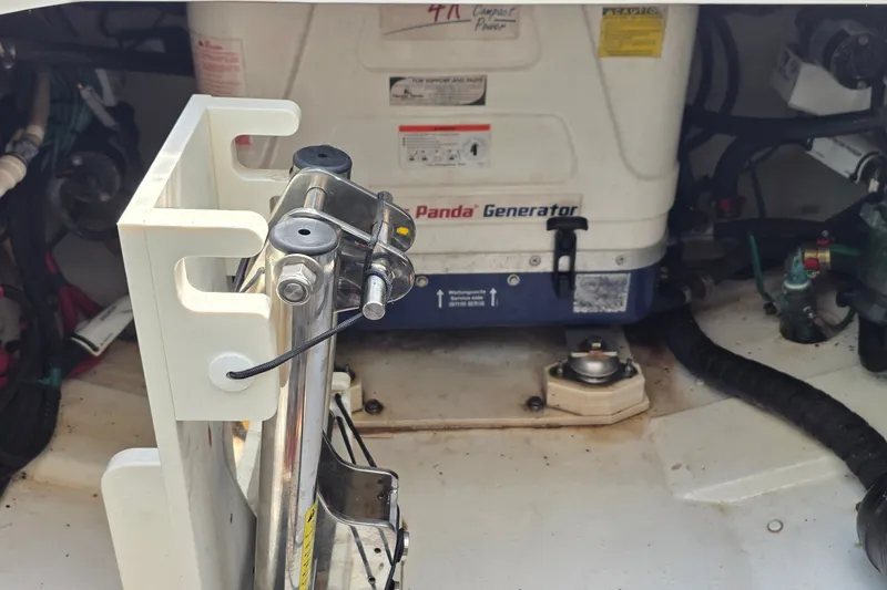 Slide: The Image of Engine compartment of a 2019 Pursuit S 328 Sport with Panda generator. - 33
