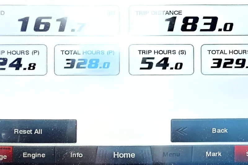 Slide: The Image of Display screen of 2019 Pursuit S 328 Sport showing trip data and engine hours. - 37