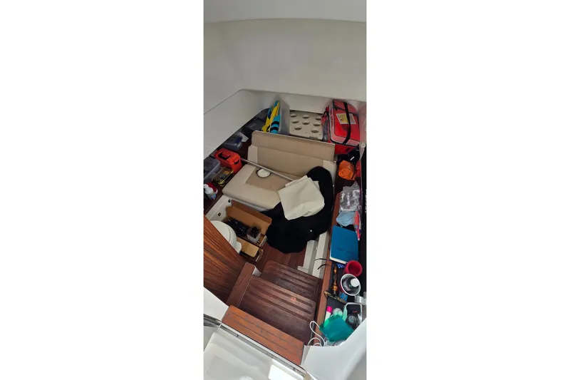 Slide: The Image of Interior cabin of 2019 Pursuit S 328 Sport boat with seating and storage items. - 41