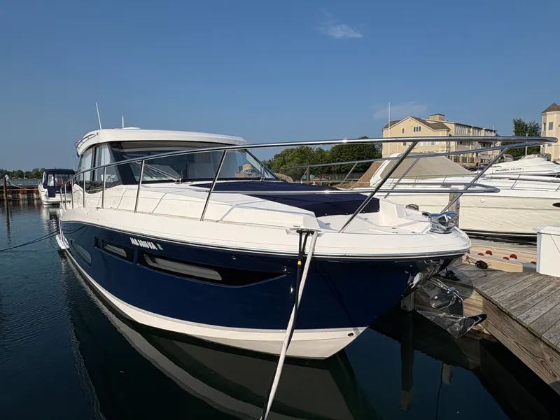 Slide: The Image of The 2024 Regal 38 Grande Coupe is docked. It features a sleek, modern design. - 1