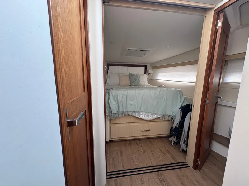 Slide: The Image of The image shows a cozy cabin with a double bed, wooden floor, and a window. - 45