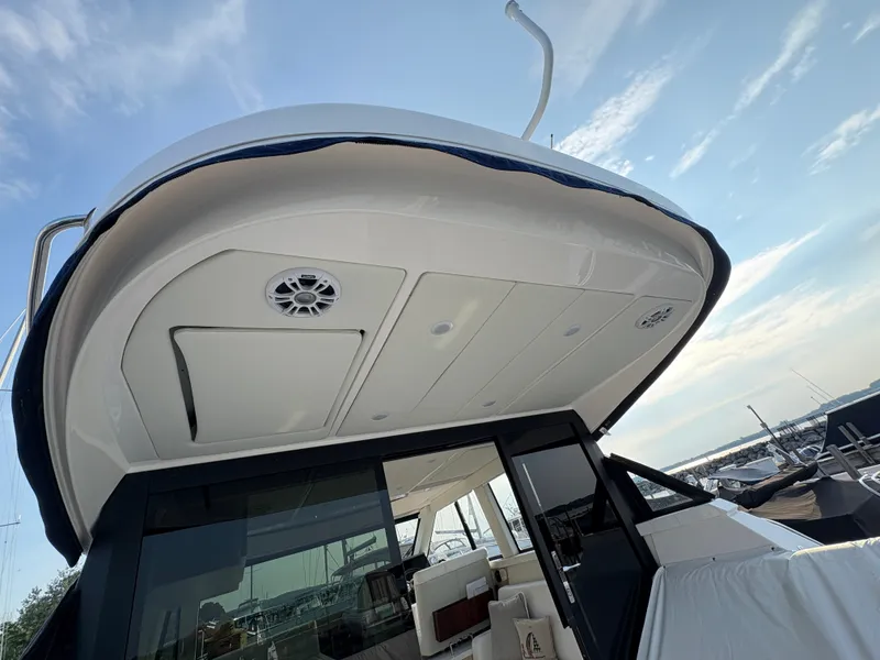 Slide: The Image of The 2024 Regal 38 Grande Coupe features a modern design with a spacious cockpit and sleek lines. - 40