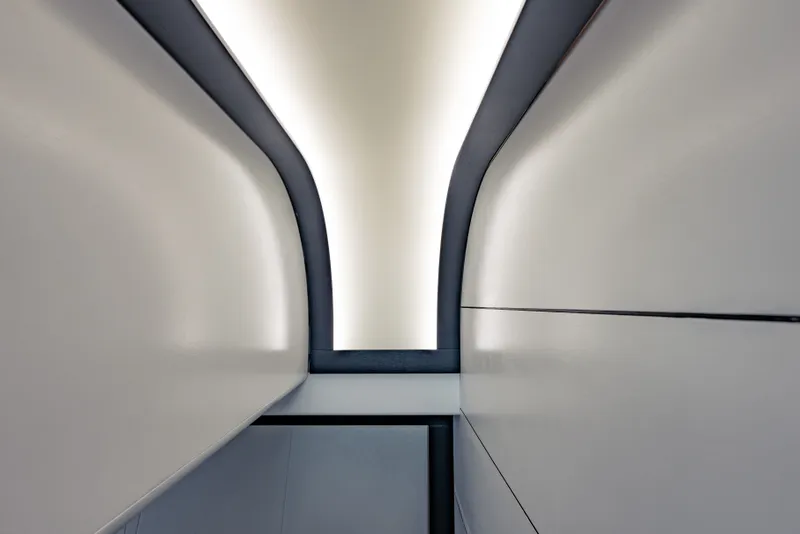 Slide: The Image of Interior ceiling design of a 2010 Pershing 80 yacht, featuring sleek, modern lines. - 50