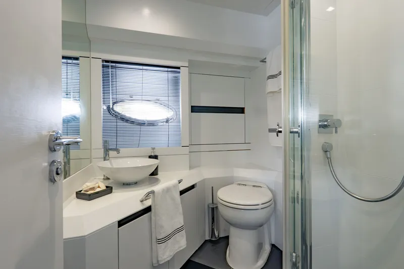 Slide: The Image of Luxurious bathroom on a 2010 Pershing 80 yacht, featuring modern fixtures and elegant design. - 67