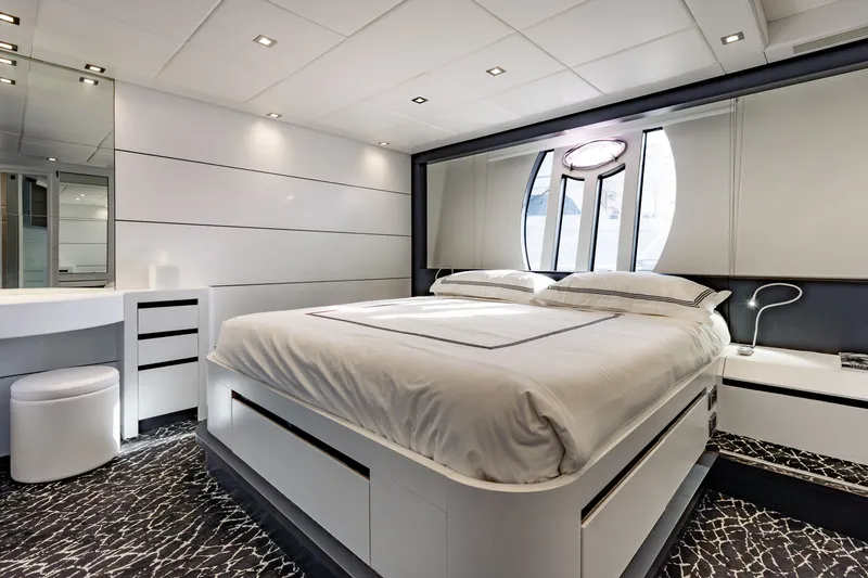 Slide: The Image of Luxurious bedroom interior on a 2010 Pershing 80 yacht, featuring modern design and elegant furnishings. - 55