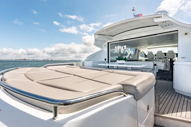 Slide: The Image of Luxurious 2010 Pershing 80 yacht with spacious deck and elegant interior on open water. - 25