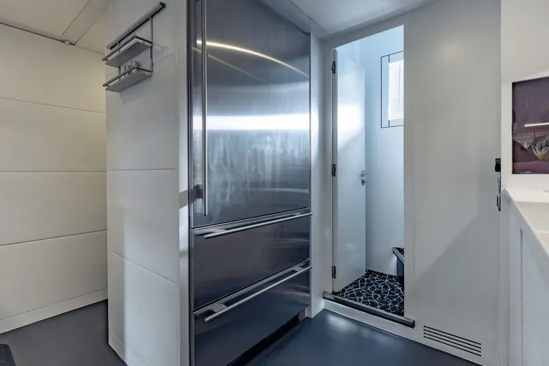 Slide: The Image of Modern interior of 2010 Pershing 80 yacht with sleek stainless steel appliances. - 85