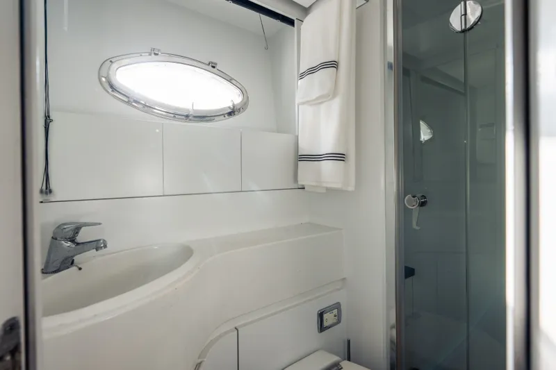 Slide: The Image of Luxurious bathroom in 2010 Pershing 80 yacht, featuring sleek design and modern fixtures. - 91