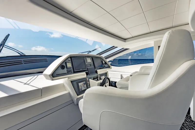 Slide: The Image of Luxurious 2010 Pershing 80 yacht cockpit with modern navigation controls and ocean view. - 42