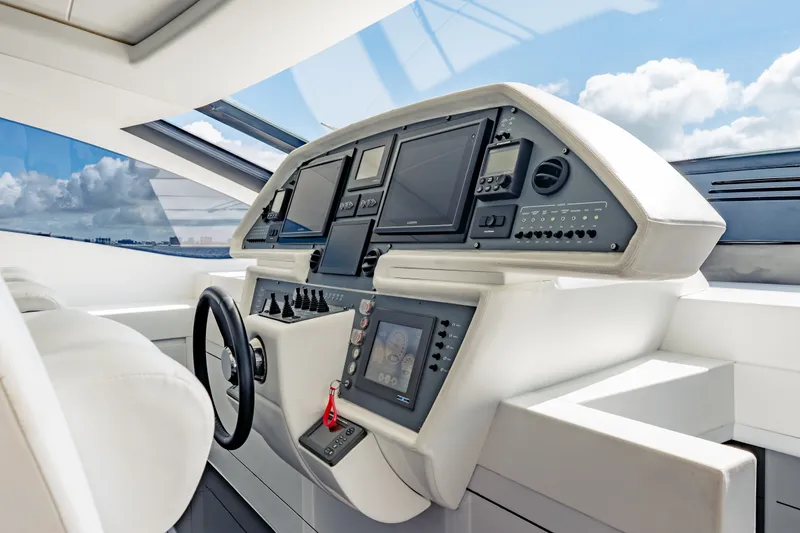 Slide: The Image of Control panel of a 2010 Pershing 80 yacht with modern navigation equipment. - 45