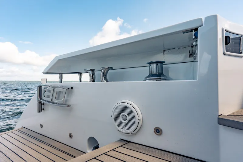 Slide: The Image of 2010 Pershing 80 yacht deck with winch and speaker, ocean view. - 27