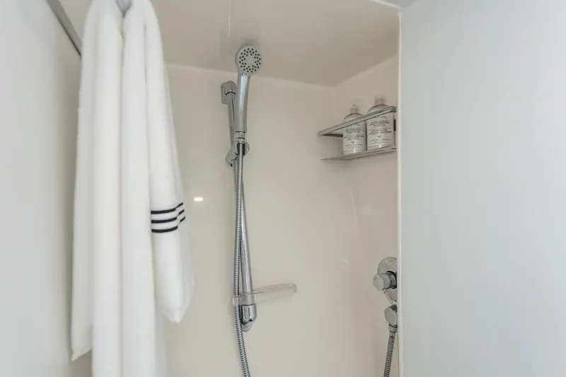 Slide: The Image of Shower area in 2010 Pershing 80 yacht with towel and toiletries. - 92