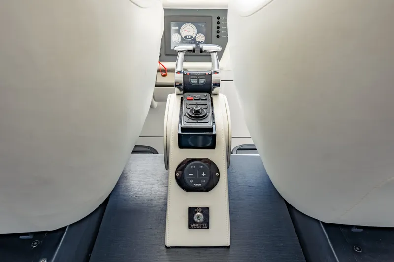 Slide: The Image of Interior view of 2010 Pershing 80 yacht cockpit controls and dashboard. - 44