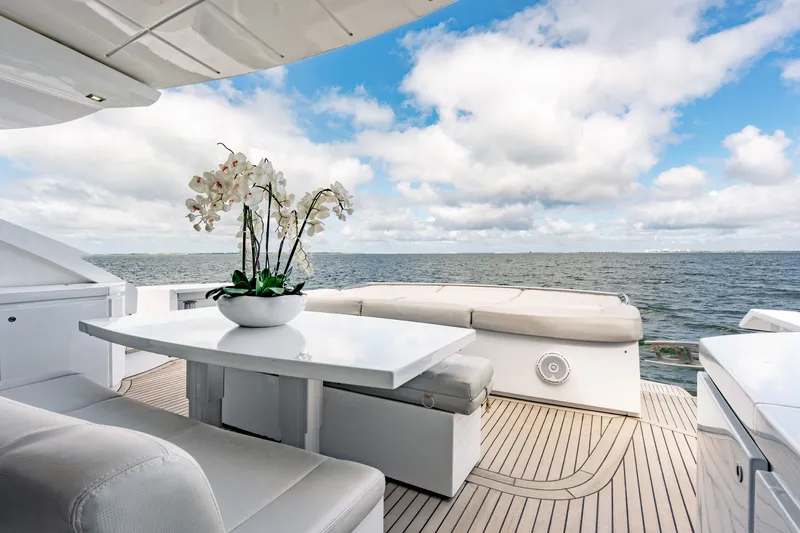 Slide: The Image of Luxurious 2010 Pershing 80 yacht deck with elegant seating and ocean view. - 21