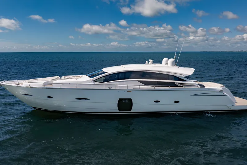 Slide: The Image of Luxurious 2010 Pershing 80 yacht cruising on open sea under clear blue sky. - 15