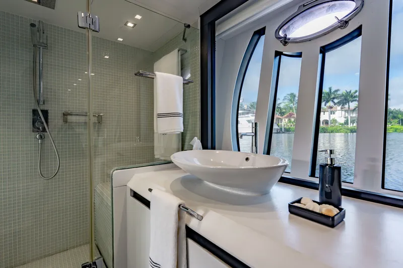 Slide: The Image of Luxurious bathroom on a 2010 Pershing 80 yacht with scenic water view. - 60