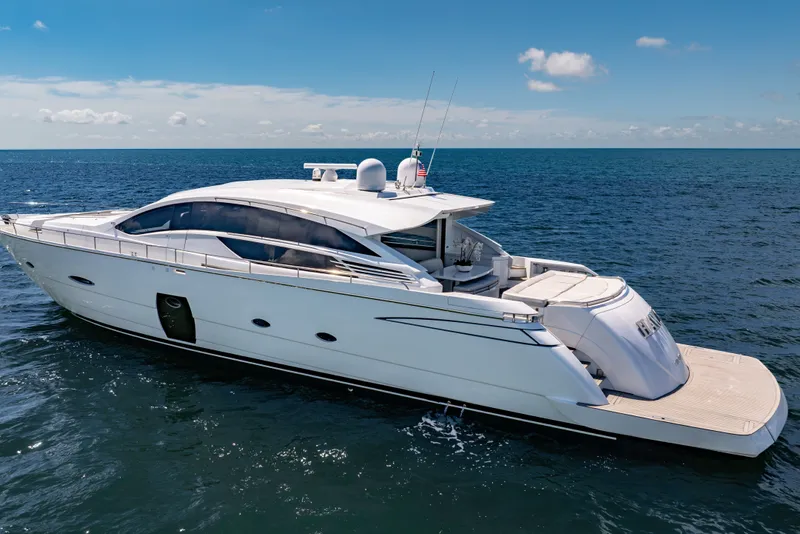 Slide: The Image of Luxury 2010 Pershing 80 yacht cruising on open sea under clear blue sky. - 16