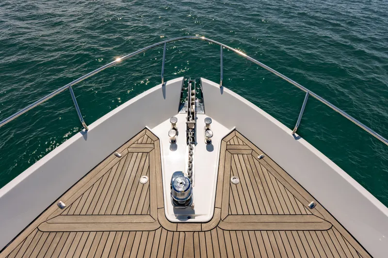 Slide: The Image of Bow of 2010 Pershing 80 yacht with teak decking on open water. - 32