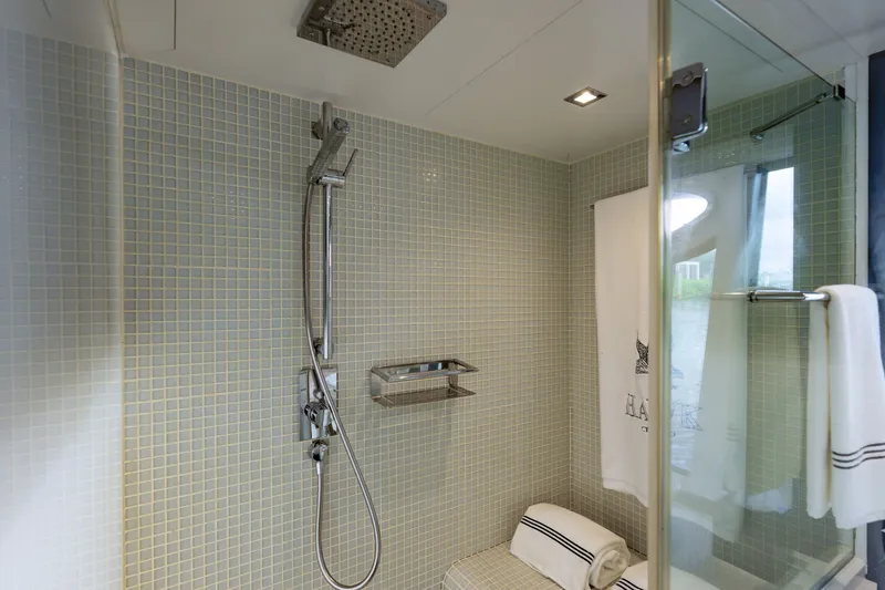 Slide: The Image of Luxurious shower area in a 2010 Pershing 80 yacht, featuring modern fixtures and elegant design. - 61