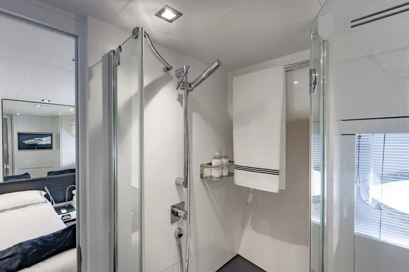 Slide: The Image of Luxurious bathroom interior on a 2010 Pershing 80 yacht, featuring modern shower and amenities. - 71