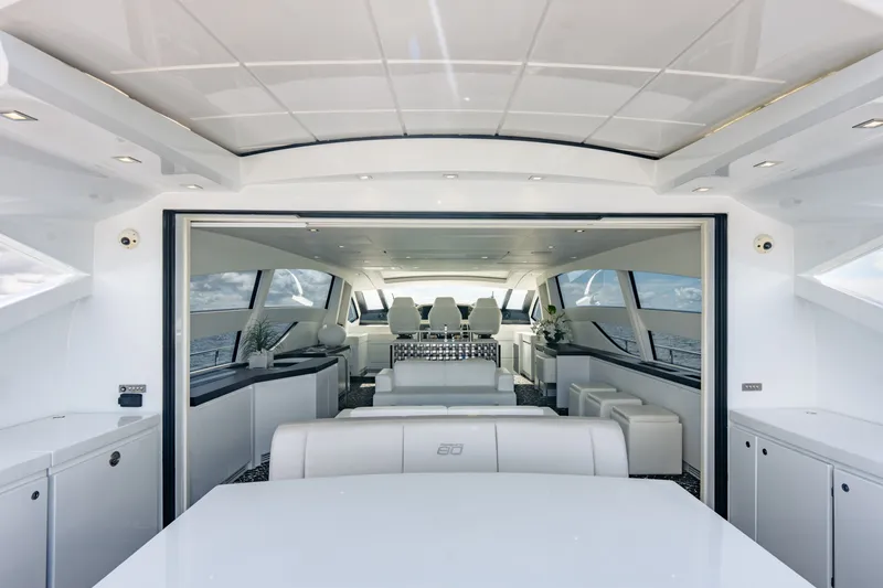 Slide: The Image of Luxurious interior of 2010 Pershing 80 yacht with modern seating and panoramic windows. - 22