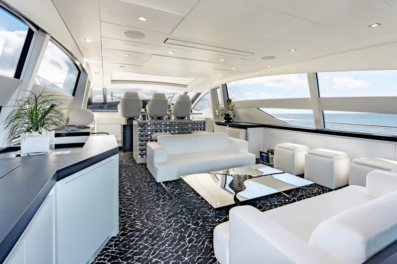 Slide: The Image of Luxurious interior of 2010 Pershing 80 yacht with modern white seating and ocean view. - 33