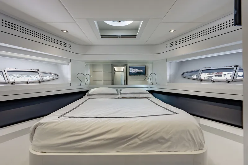 Slide: The Image of Luxurious bedroom interior of 2010 Pershing 80 yacht with modern design and elegant bedding. - 63