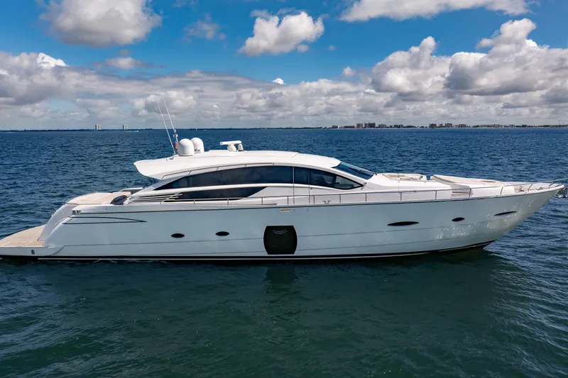 Slide: The Image of Luxury 2010 Pershing 80 yacht cruising on open water under a partly cloudy sky. - 10