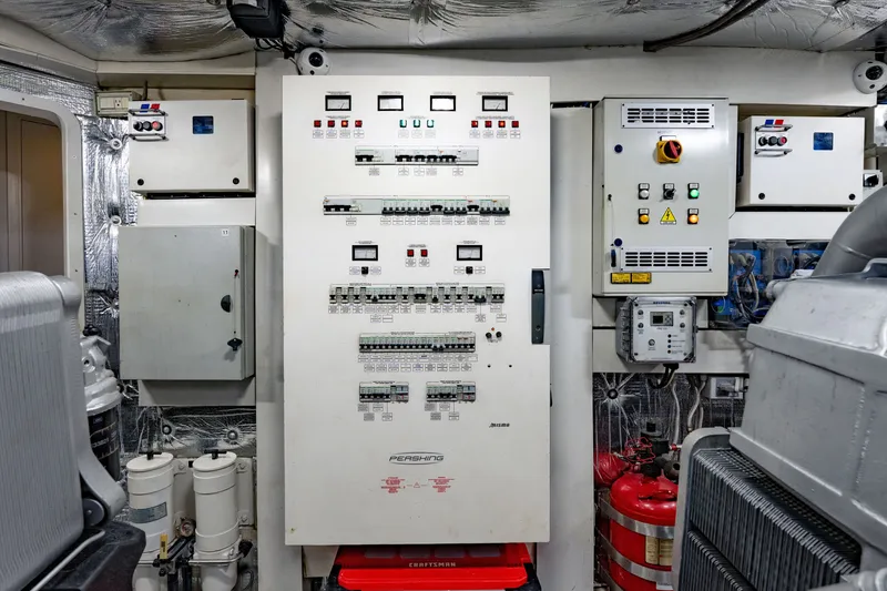 Slide: The Image of Electrical control panel in a 2010 Pershing 80 yacht engine room. - 97