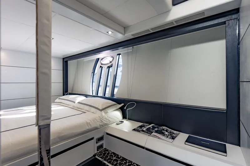 Slide: The Image of Luxurious bedroom interior on a 2010 Pershing 80 yacht, featuring modern design and elegant decor. - 51