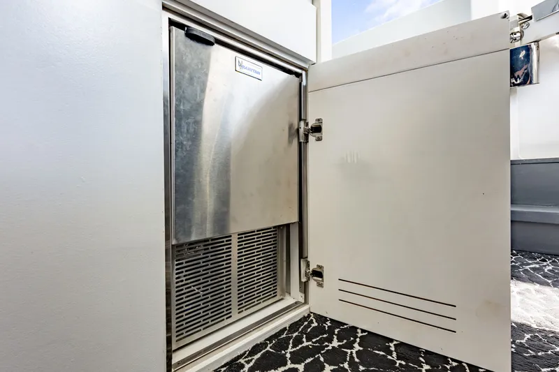 Slide: The Image of Built-in stainless steel appliance on Pershing 80 yacht, 2010 model, with open cabinet door. - 41