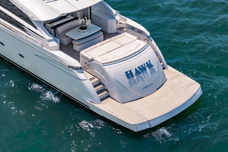 Slide: The Image of Luxury Pershing 80 yacht from 2010, named "HAWK," cruising on open water. - 20